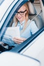 smiling businesswoman reading newspaper Royalty Free Stock Photo