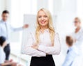 Smiling businesswoman or secretary in office Royalty Free Stock Photo