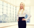Smiling businesswoman or secretary over city Royalty Free Stock Photo