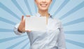 Smiling businesswoman showing white blank card Royalty Free Stock Photo