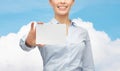 Smiling businesswoman showing white blank card Royalty Free Stock Photo