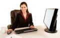 Smiling Businesswoman Sitting at her Desk