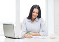 Smiling businesswoman or student with laptop Royalty Free Stock Photo