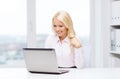 Smiling businesswoman or student with laptop Royalty Free Stock Photo