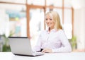 Smiling businesswoman or student with laptop Royalty Free Stock Photo