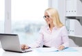 Smiling businesswoman or student with laptop Royalty Free Stock Photo