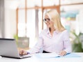 Smiling businesswoman or student with laptop Royalty Free Stock Photo