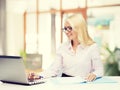 Smiling businesswoman or student with laptop Royalty Free Stock Photo