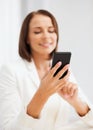 Smiling businesswoman or student with smartphone Royalty Free Stock Photo