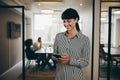 Smiling businesswoman texting on her phone Royalty Free Stock Photo