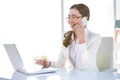 Smiling businesswoman using her laptop Royalty Free Stock Photo