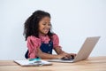 Smiling businesswoman using laptop computer at desk Royalty Free Stock Photo