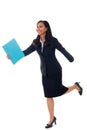 Smiling businesswoman walking with blue folder isolated on white in full body. Mixed-race asian / white caucasian brunette Royalty Free Stock Photo