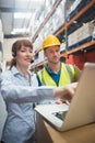 Smiling businesswoman wearing headset using laptop Royalty Free Stock Photo