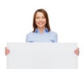 Smiling businesswoman with white blank board Royalty Free Stock Photo