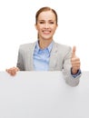 Smiling businesswoman with white blank board Royalty Free Stock Photo