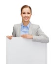 Smiling businesswoman with white blank board Royalty Free Stock Photo