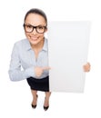 Smiling businesswoman with white blank board Royalty Free Stock Photo