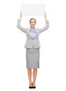 Smiling businesswoman with white blank board Royalty Free Stock Photo