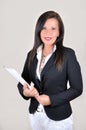 Smiling businesswoman with white file