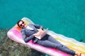 Smiling businesswoman working on laptop at seaside Royalty Free Stock Photo