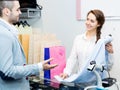 Smiling cashier and satisfied customer Royalty Free Stock Photo