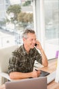 Smiling casual businessman having a phone call Royalty Free Stock Photo