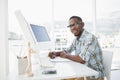 Smiling casual businessman writing on paper Royalty Free Stock Photo