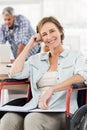 Smiling casual businesswoman in wheelchair Royalty Free Stock Photo