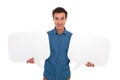Smiling casual man holding two speech bubles Royalty Free Stock Photo