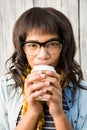 Smiling casual woman posing with glasses while drinking coffee Royalty Free Stock Photo