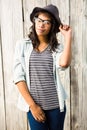 Smiling casual woman posing with glasses and hat Royalty Free Stock Photo