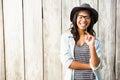 Smiling casual woman posing with glasses and hat Royalty Free Stock Photo