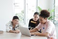 Smiling Caucasian and African student is online learning and make homework for home school. They are researching knowledge with Royalty Free Stock Photo