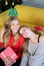 Smiling Caucasian couple sister is Laughing happily in Christmas party. Lifstyle of Teenage lesbian on holiday.
