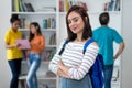 Smiling caucasian female student with group of students Royalty Free Stock Photo