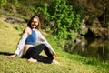 Smiling caucasian woman enjoy outdoors yoga exercise
