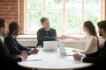 Smiling CEO greeting female business colleague by handshake Royalty Free Stock Photo