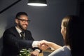 Happy male shaking hand of female job applicant during interview Royalty Free Stock Photo