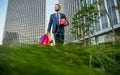 smiling mature businessman in suit hold packages and gift box outside the office, valentines day.