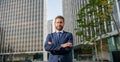 smiling charismatic mature businessman in suit outside the office, charisma