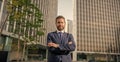 smiling charismatic mature businessman in suit outside the office, charisma Royalty Free Stock Photo