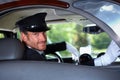 Smiling chauffeur in limousine Royalty Free Stock Photo