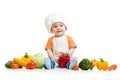 Smiling chef kid boy with vegetables isolated on white background Royalty Free Stock Photo