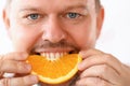 Smiling Chef Eating Tropical Citrus Slice Portrait Royalty Free Stock Photo