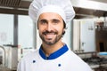 Smiling chef in his kitchen Royalty Free Stock Photo