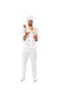 Chef juggling fresh fruits on white background
