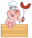 Smiling Chef Pig Cartoon Mascot Character Holding A Sausage On A Bbq Fork Over A Wooden Sign Giving A Thumb Up Royalty Free Stock Photo