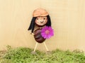 Smiling chestnut figure with autumn flower