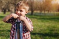 Smiling chestnut haired boy with spade in garden Royalty Free Stock Photo